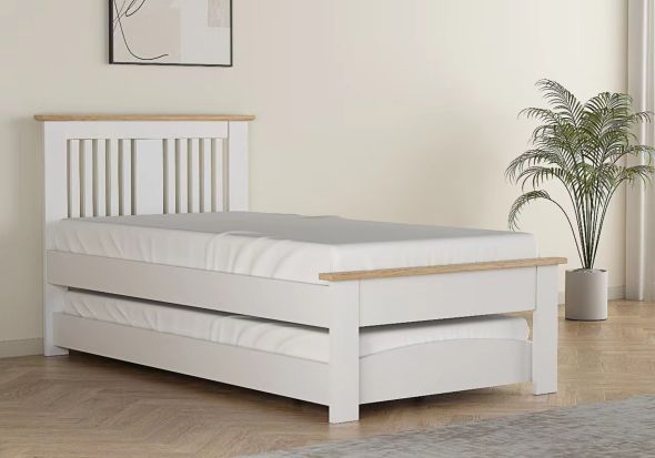 Contemporary oak finish guest bed with pull out under bed. Slatted headboard with a plinth top. Low foot end with a plinth top.